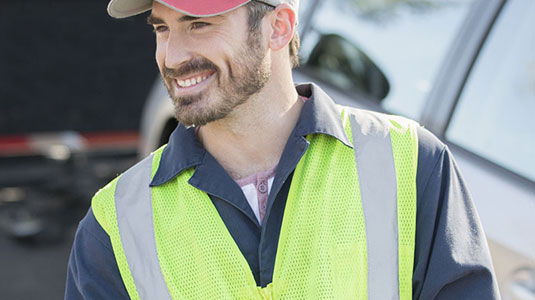 Tow truck driver smiling