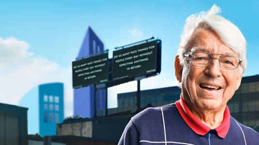 Man standing in front of buildings