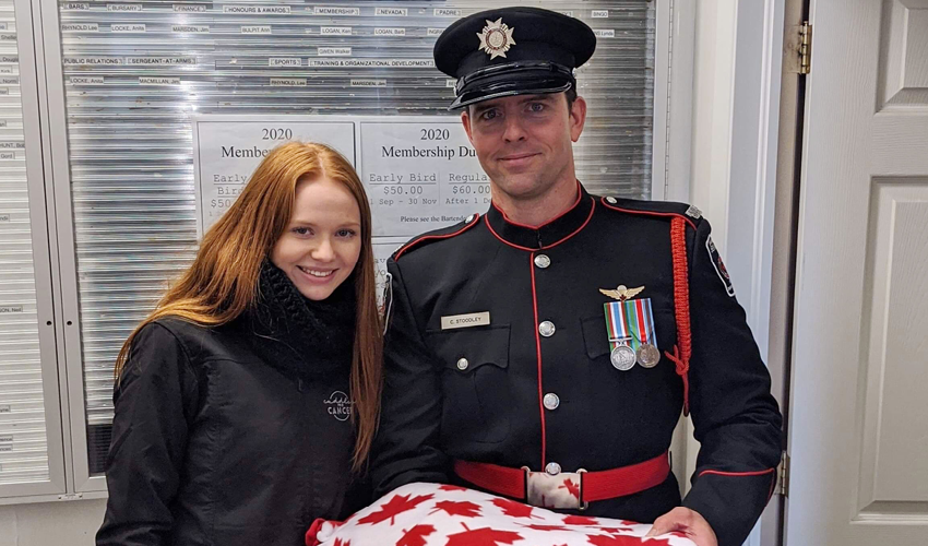 Faith Dickinson posing with officer