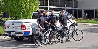 A CAA tow truck and Bike Assist responders outside CAA building