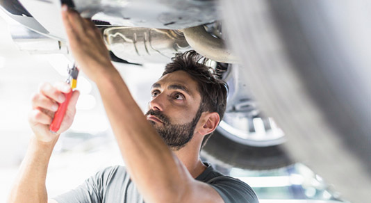 Mechanic fixing car