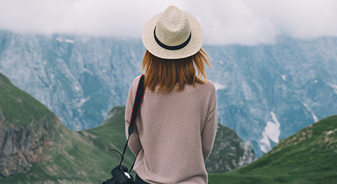 Woman travelling along mountains