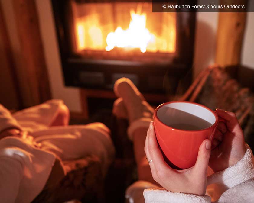 Couple in front of fireplace