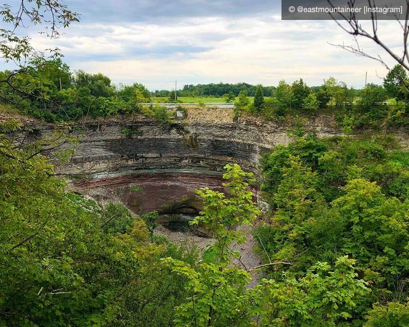 Trees surrounding big hole