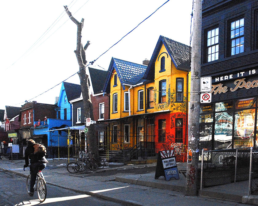 Man riding his bike in the Kensington Market area