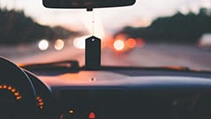 Car driving on highway at night